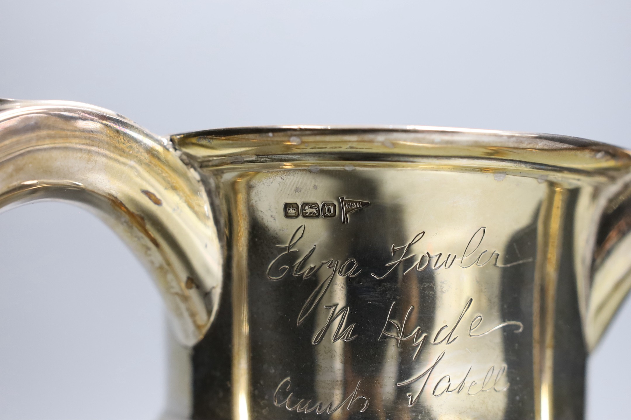 A George V silver tyg, with engraved signatures throughout, Walker & Hall, Sheffield, 1913, height 18.9cm, 23.2oz.